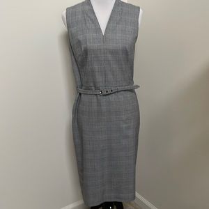 Black and white plaid belted dress. Good condition. Belt loop pulled.